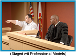 Male witness in a courtroom pointing something out to the judge (Staged with Professional Models).