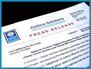 Close up of a mock press release from Justice Solutions.