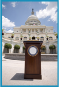 Podium positioned in front of the U.S. Capitol.