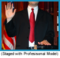 Male witness in black suit being sworn in. (Staged with Professional Model).