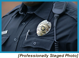 Police badge on the chest of a police officer (Staged with Professional Model).